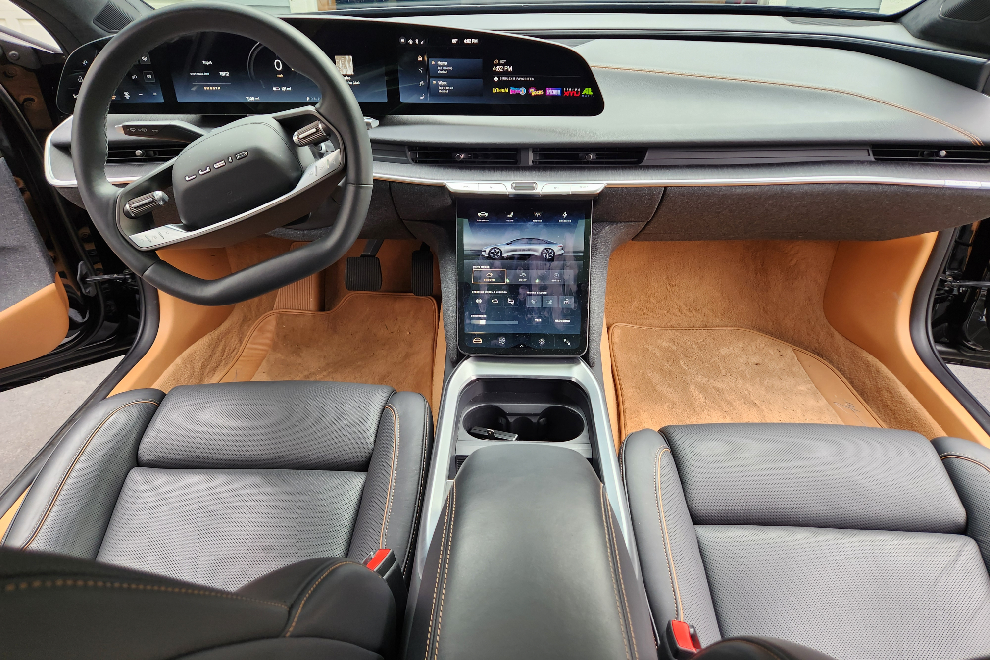 The Lucid Air Touring has comfortable front seating with a relatively uncluttered dashboard.