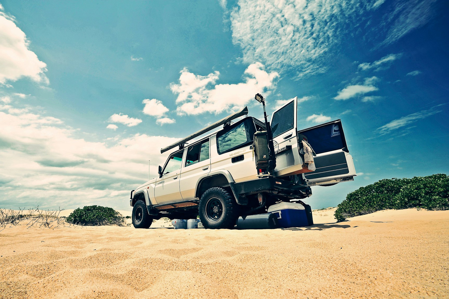 White Jeep camping in the Australian desert.