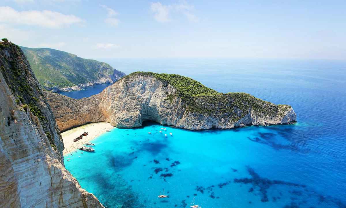 blue ocean next to rock formations