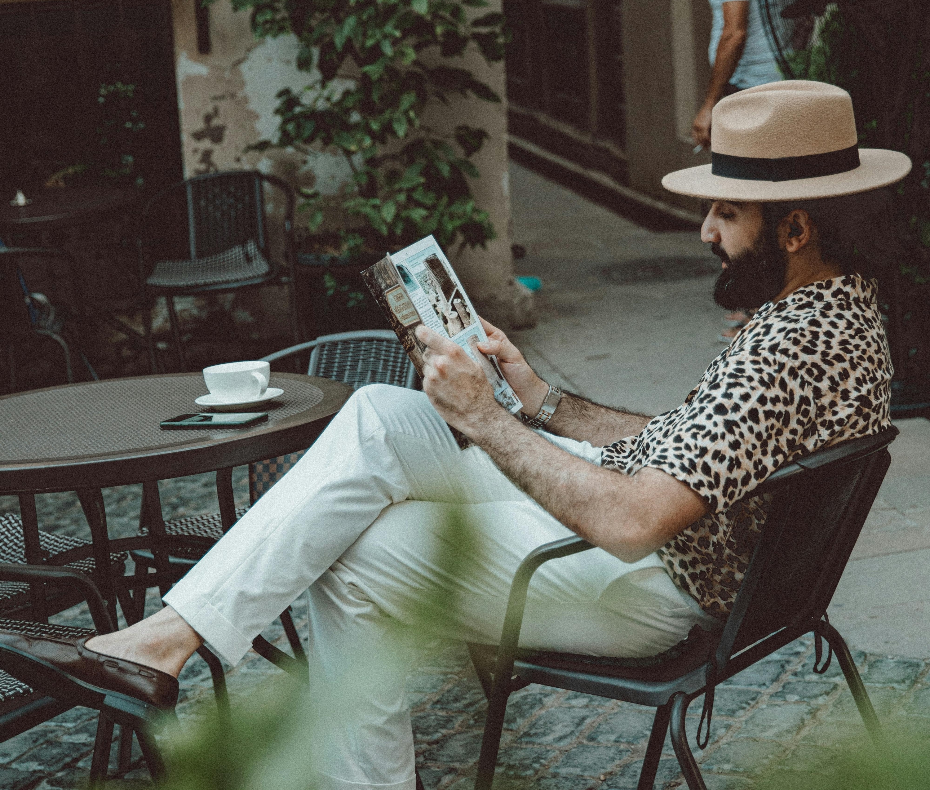 Man in fedora at a cafe