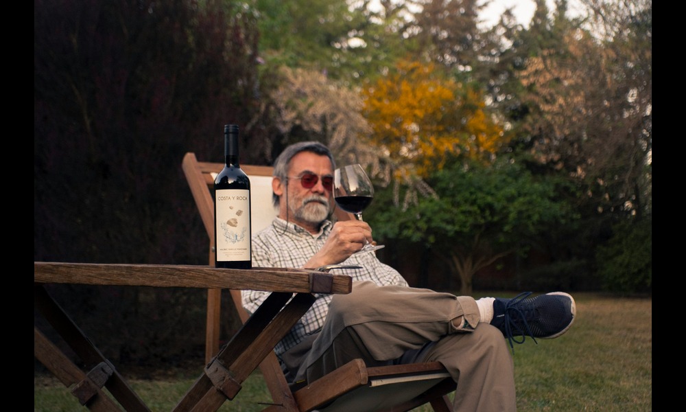 Man drinking wine in a chair