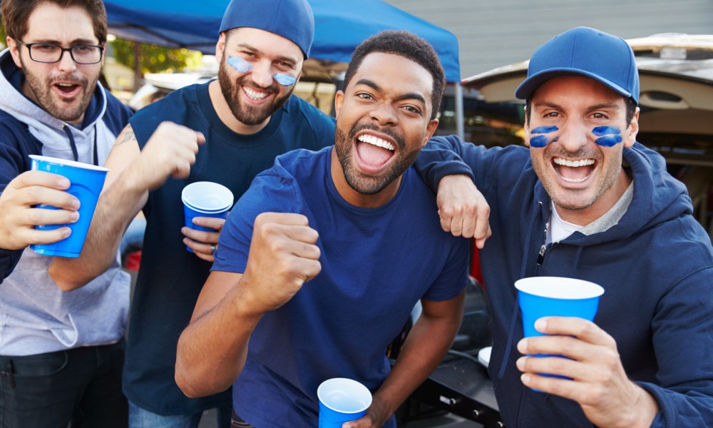 Fans celebrating at the tailgating party