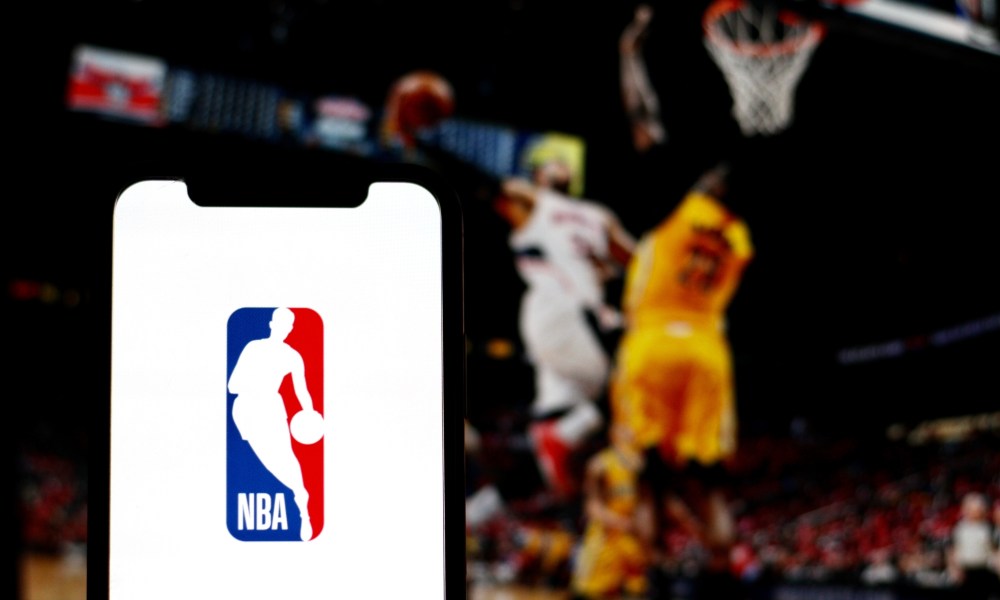 the logo of NBA is displayed on a smartphone screen