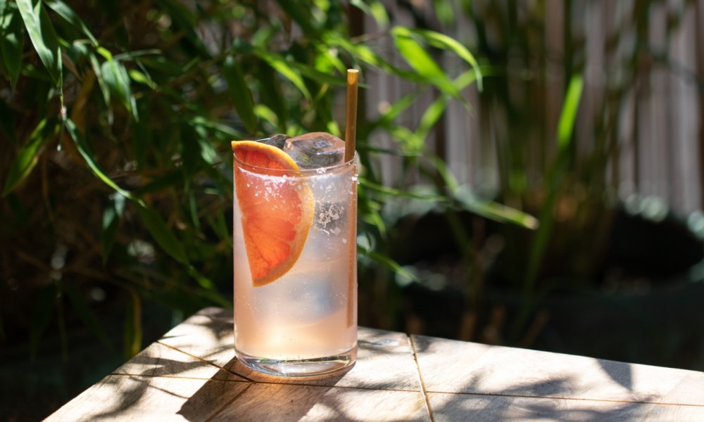 Refreshing Paloma Cocktail with clear ice, Tequila and Grapefruit