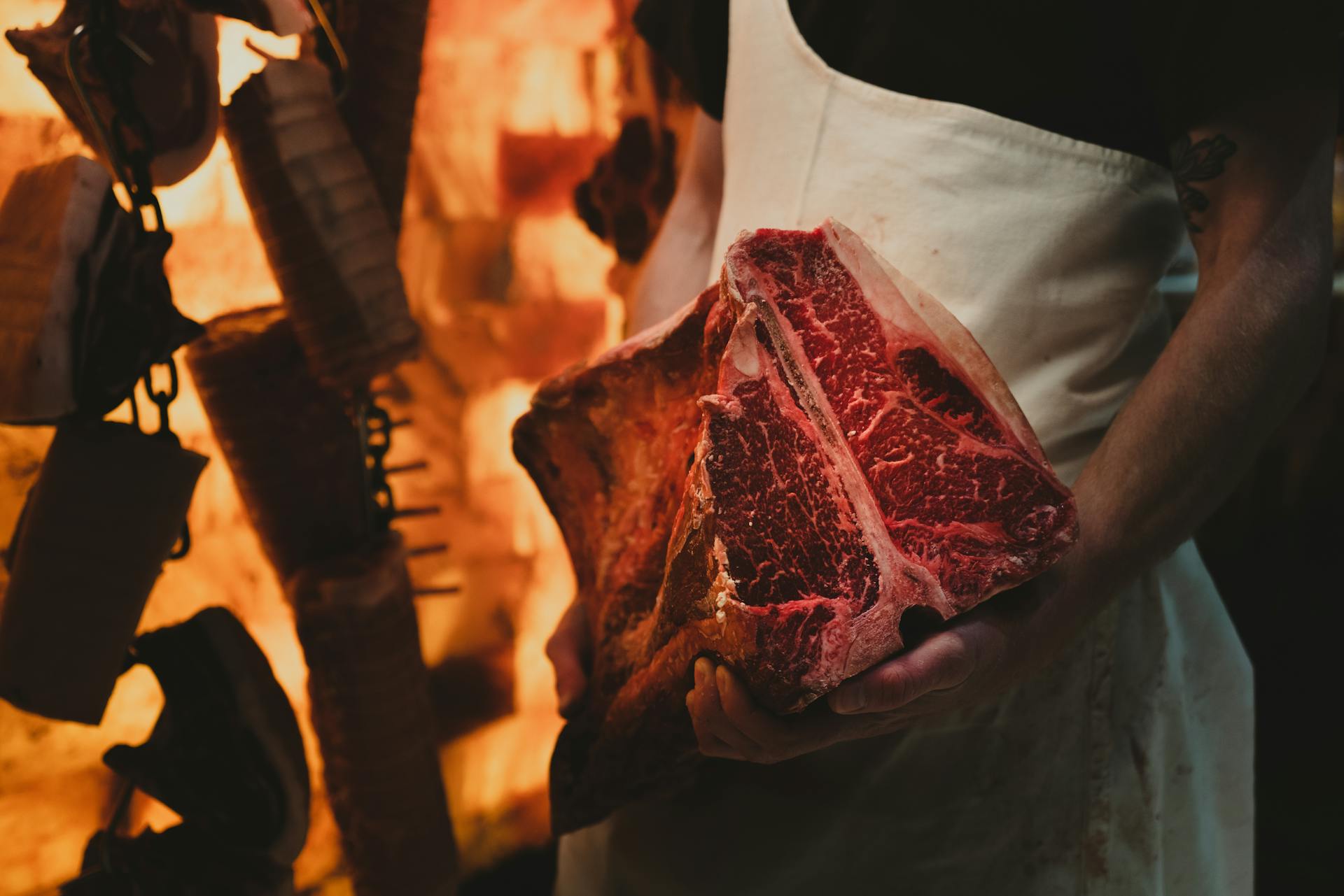 Butcher holding steak