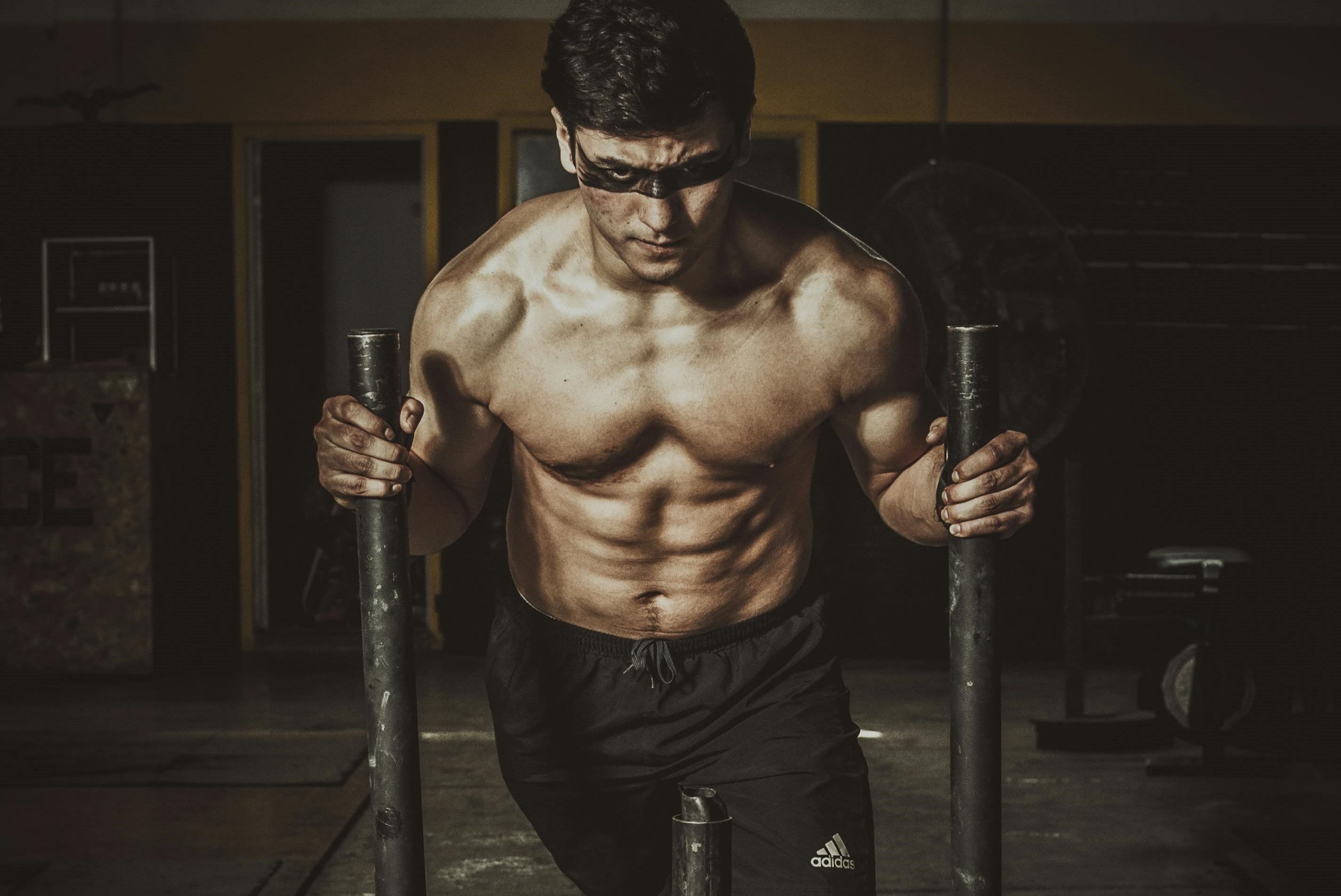 Man doing sled push.