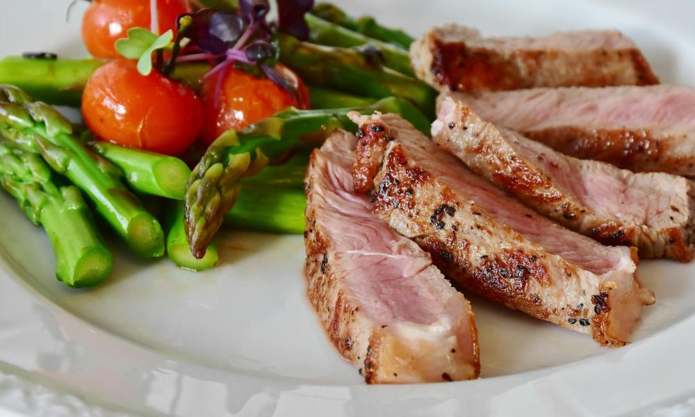 Dinner plate with cooked meat and vegetables