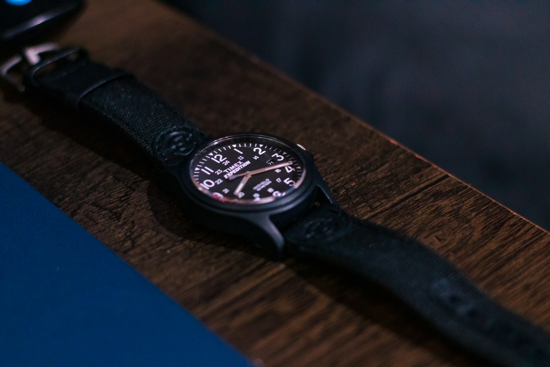 Close-up of a watch on a wooden table