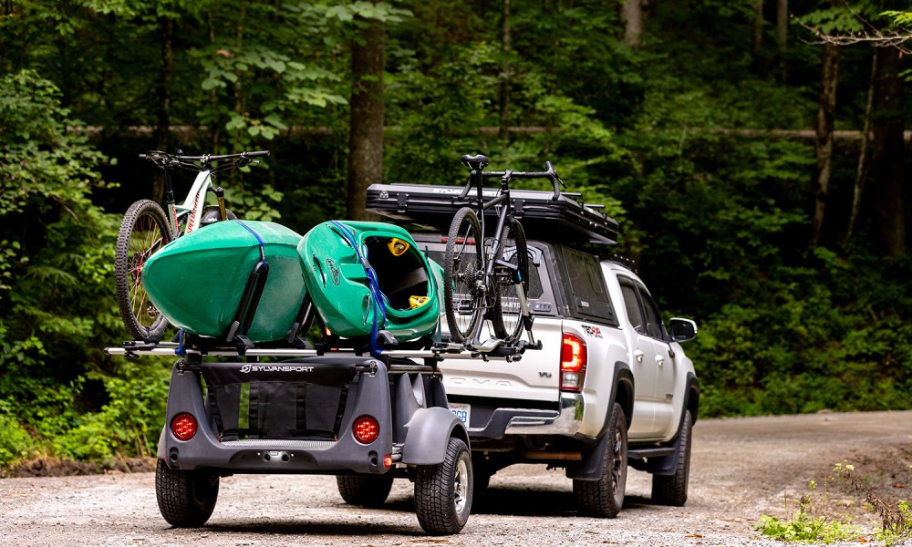 SylvanSport's 2025 Micro Adventure Series line-up mounted to a white Toyota Tacoma pickup truck