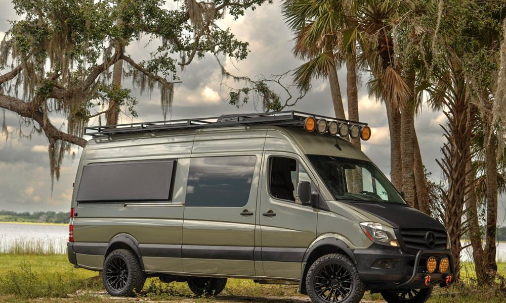 War Horse All-Terrain custom camper van parked near a lake in Florida.