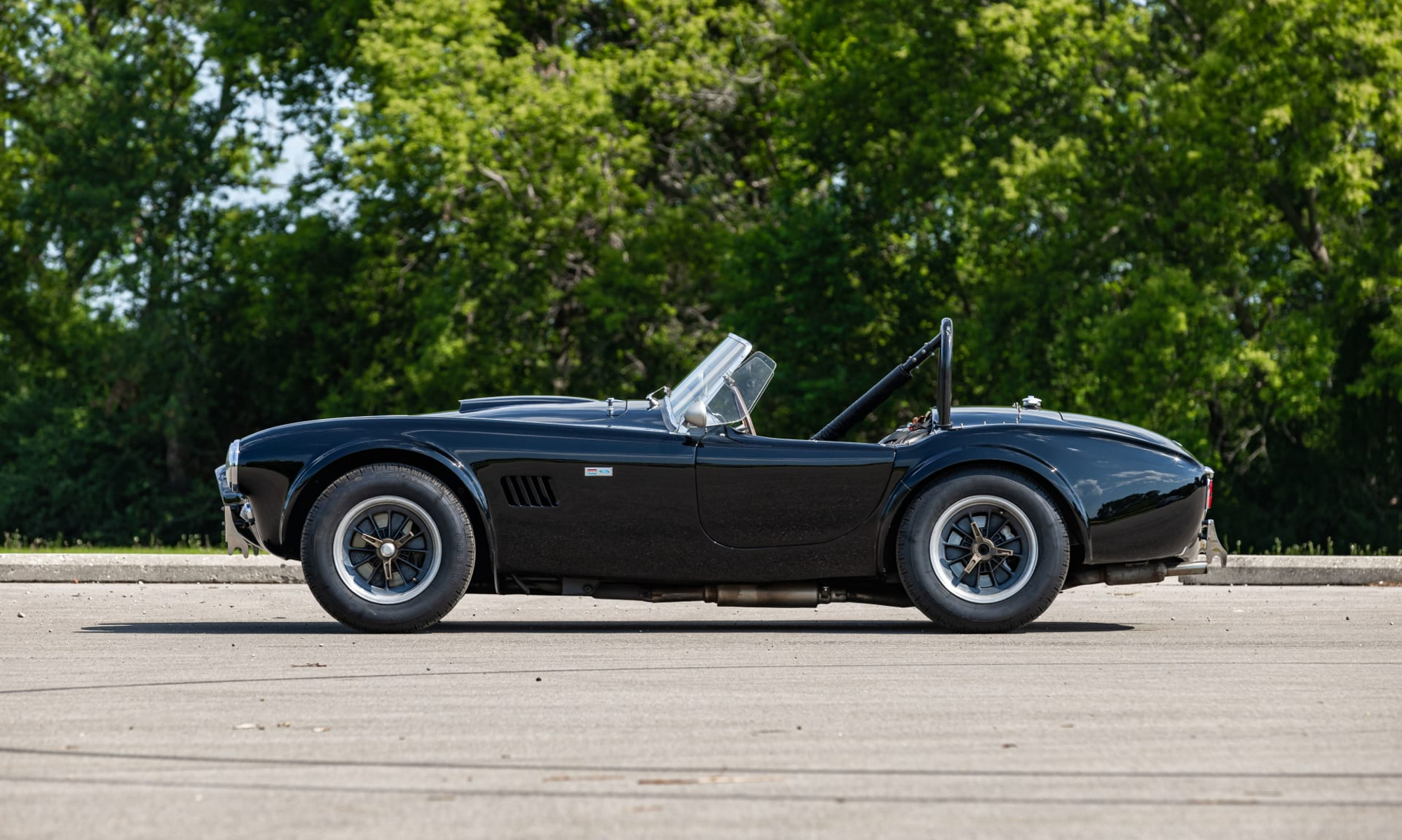 steve mcqueen cobra auction 1963 shelby 289 driven by left profile view