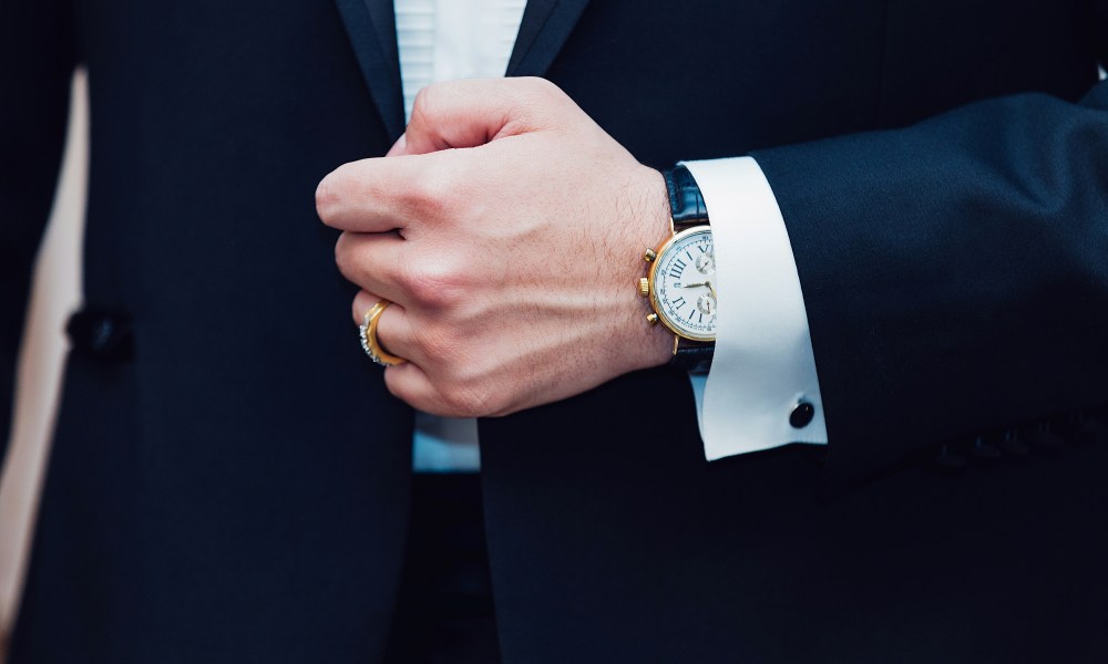 mens fashion accessories fall 2024 man in tux with ring and watch