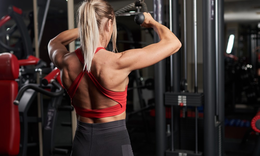 Woman doing face pulls.