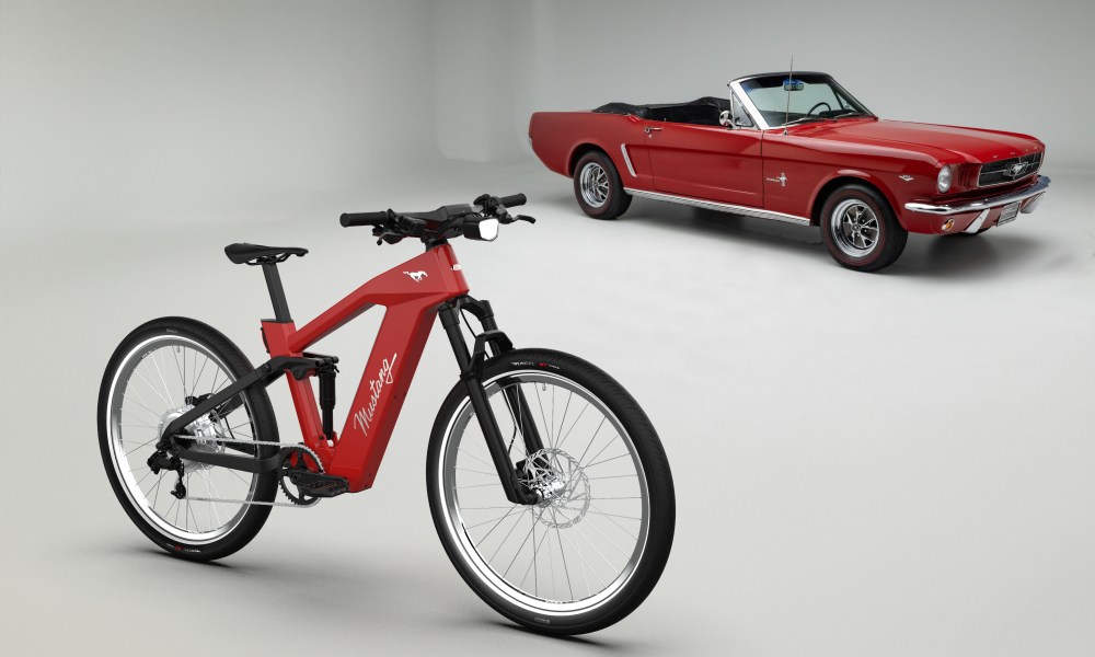 Mustang Ford Heritage Edition e-bike with a red Mustang convertible.