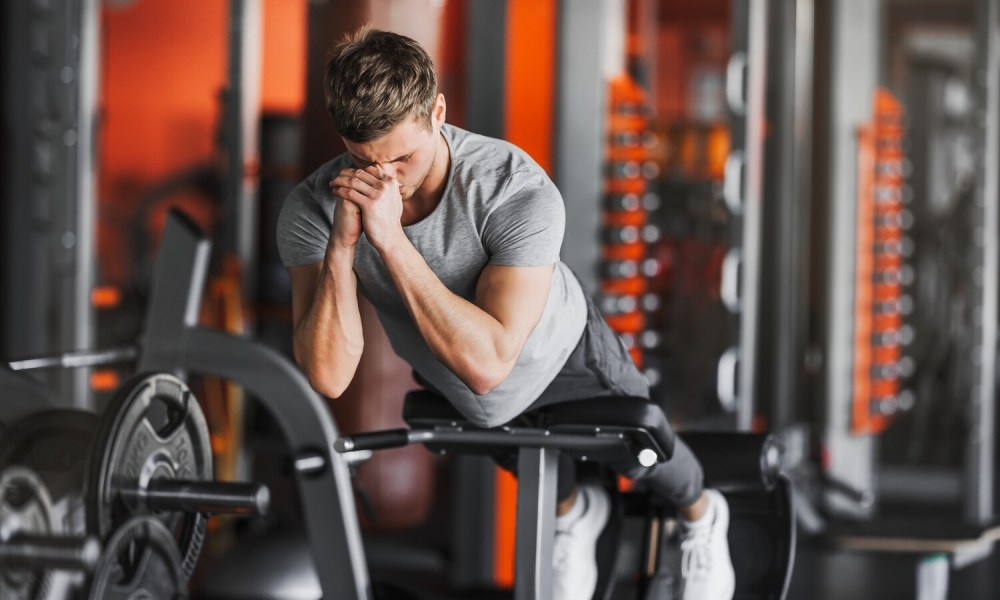 Man doing hyperextensions.