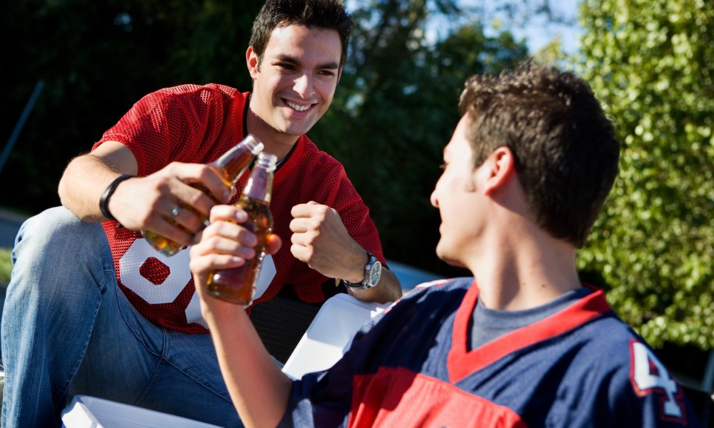 Group of friends doing football tailgating.