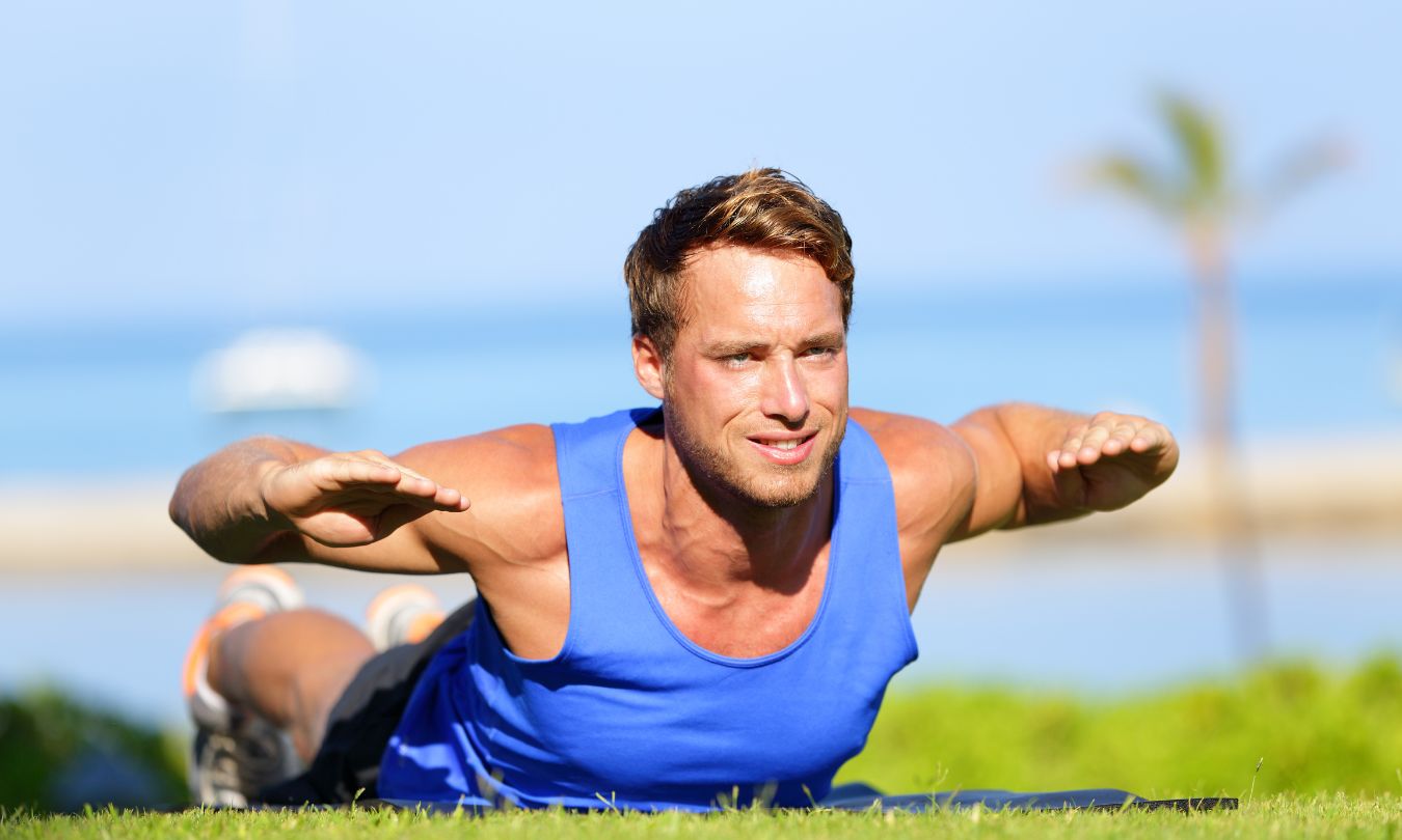 man doing lower back extension workout 