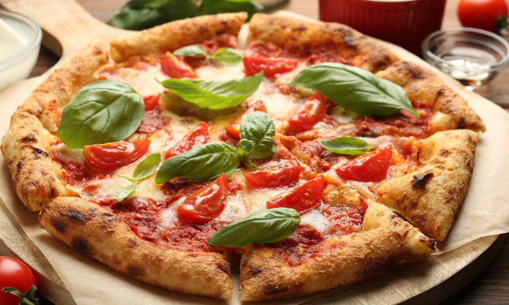 Delicious Margherita pizza on table, closeup view