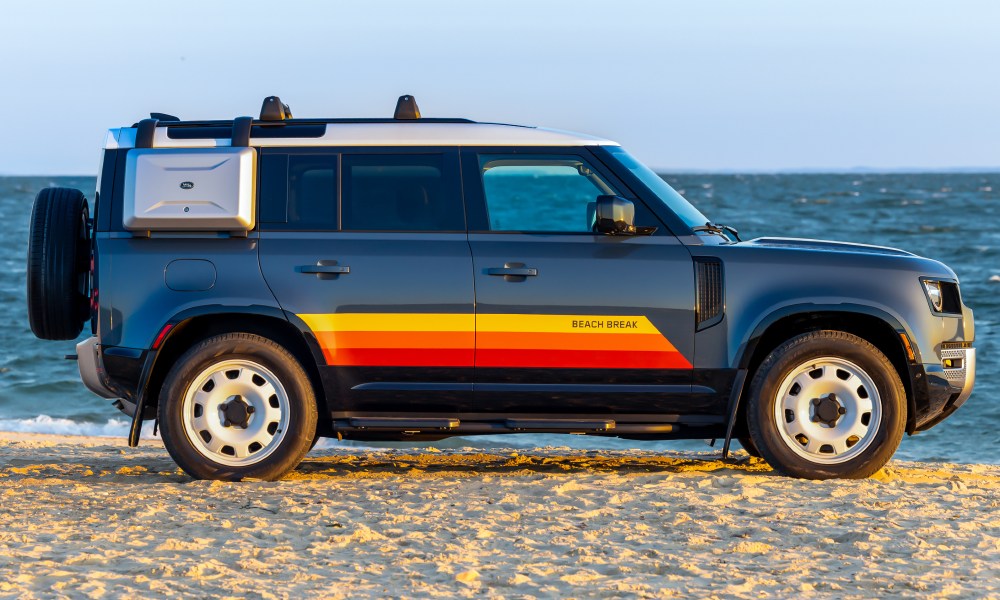 2024 Defender Beach Break limited edition parked by the beach full right side profile shot.