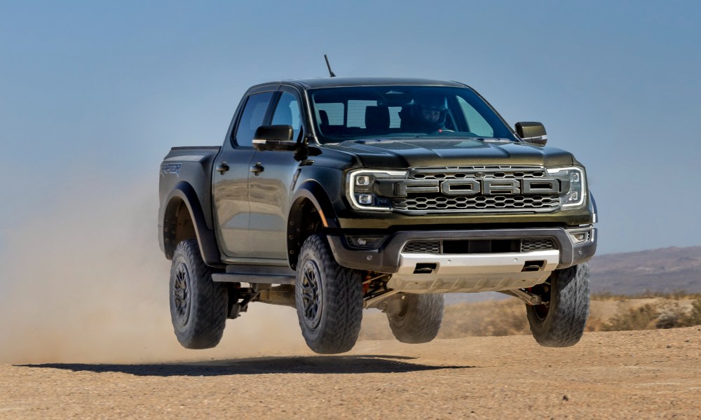 2024 Ford Ranger Raptor airborne racing across flat desert.