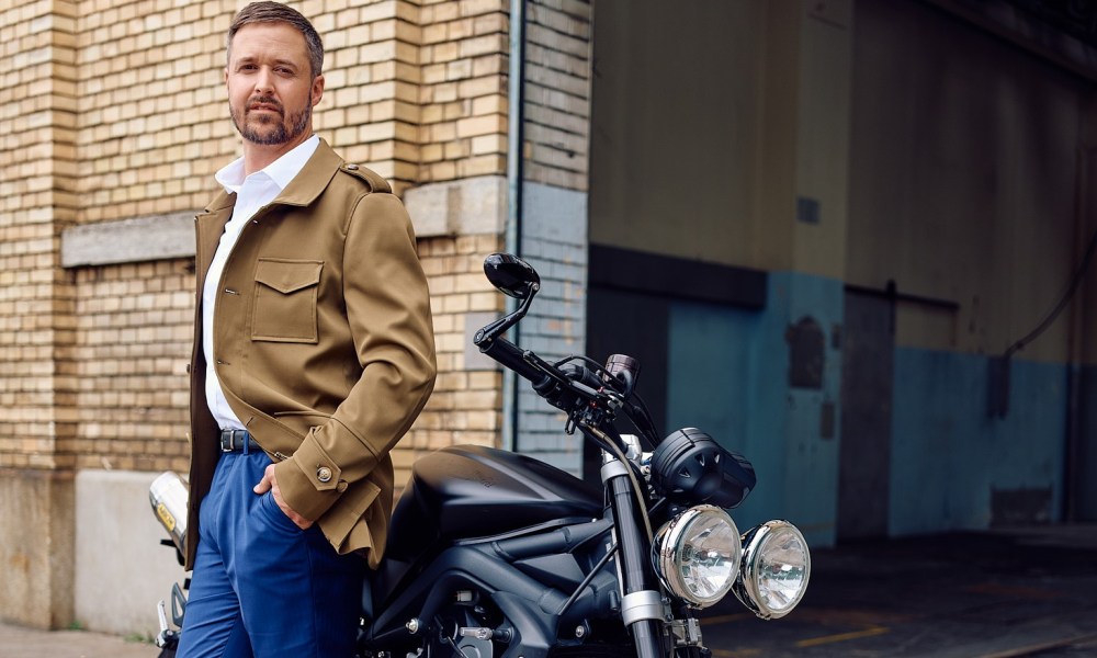 Tom Luthi leaning on motorcycle