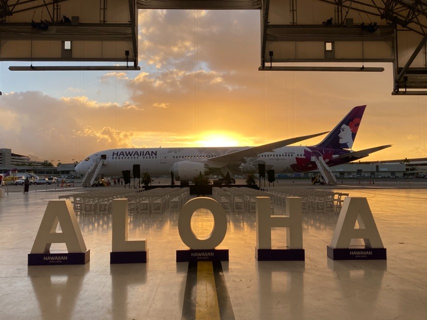 Aloha sign and sunrise Hawaiian airlines