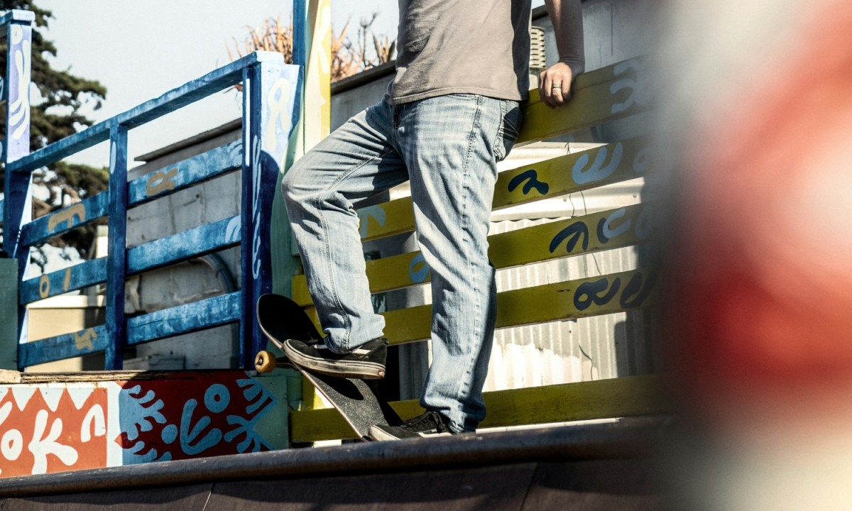 Man in baggy jeans with a skateboard