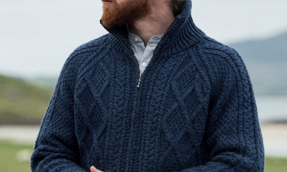 Man wearing a blue zip-up cardigan