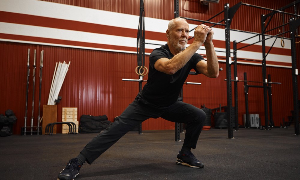 Man doing side lunges