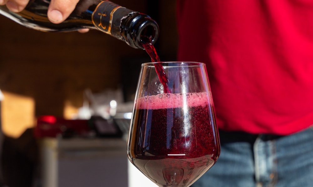 Lambrusco wine being poured into a glass