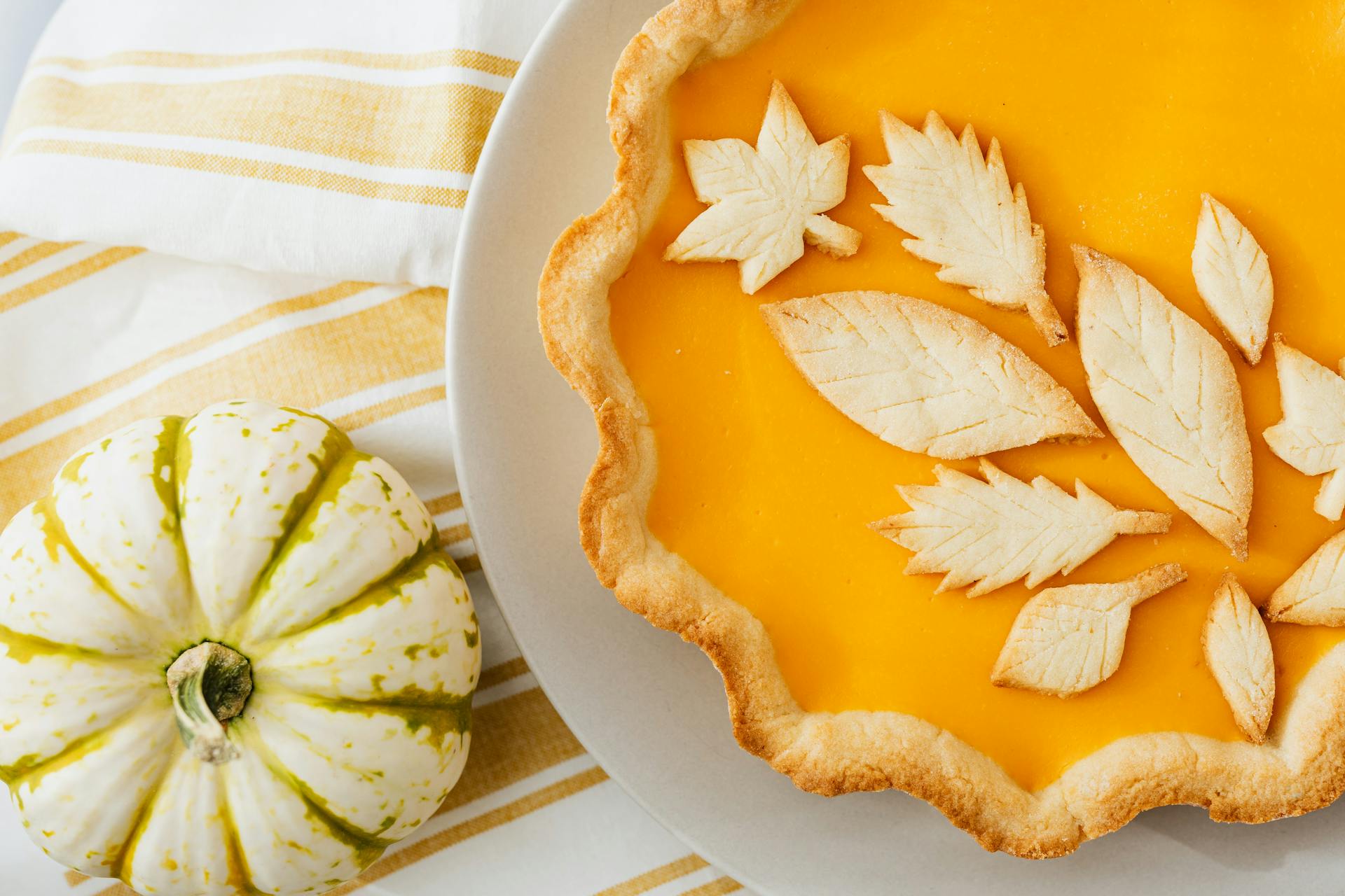 Leaf decorated pumpkin pie