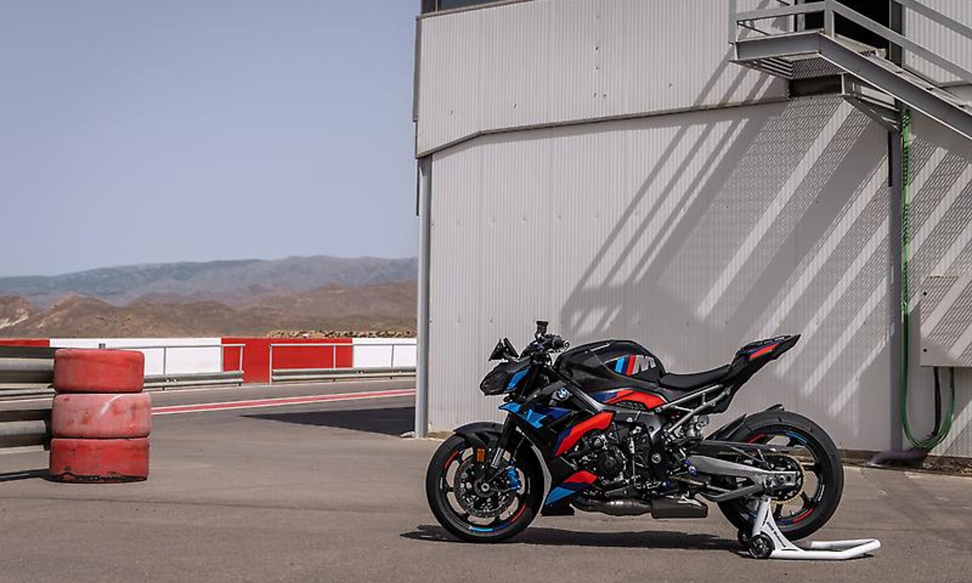 2025 BMW M 1000 R by a race track timing tower