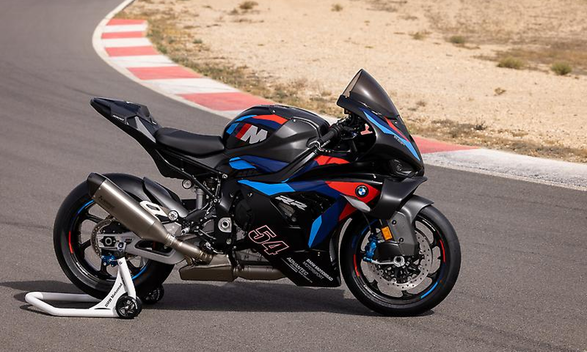 2025 BMW M 1000 RR parked on a race track.