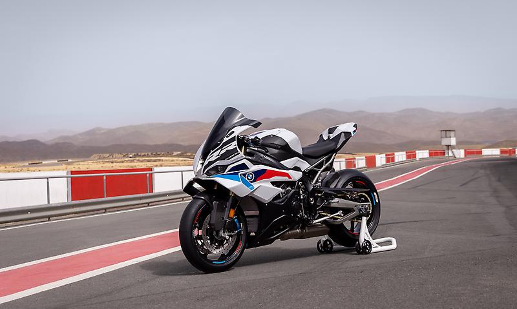 2025 BMW S 1000 RR parked on a race track.