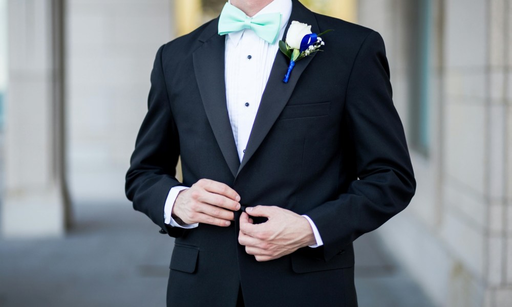 Man in tux with lapel flower