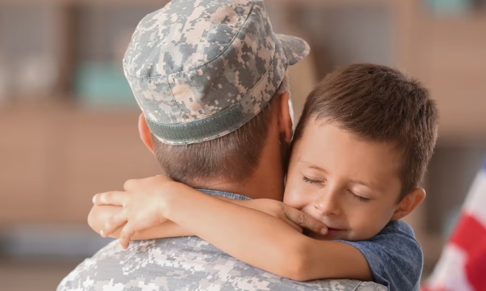 Soldier hugging his son