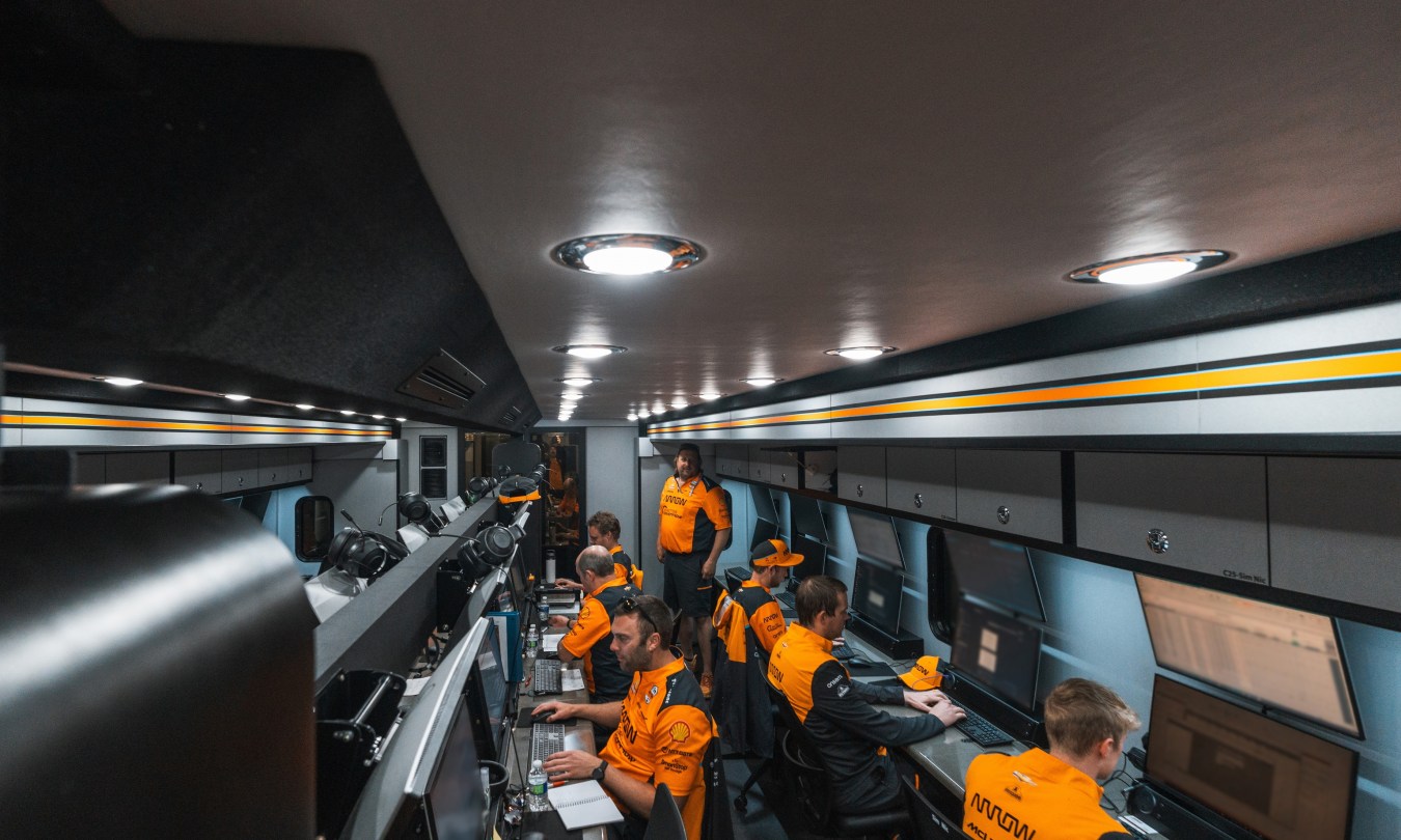 The full Arrow McLaren operations team working inside the Strategy Control trailer