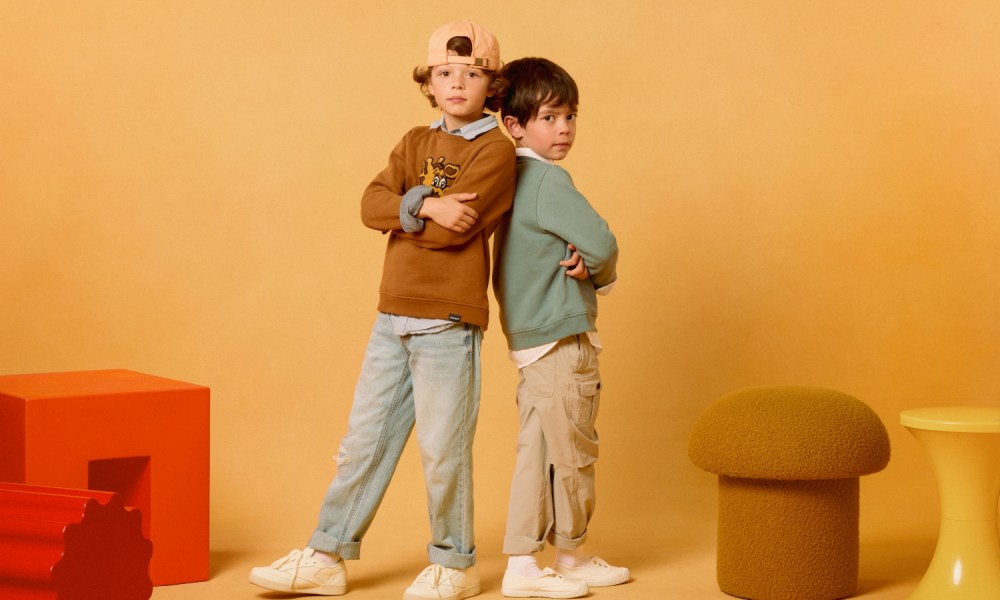 Two kids in Bonobos Toys 'R' Us sweaters