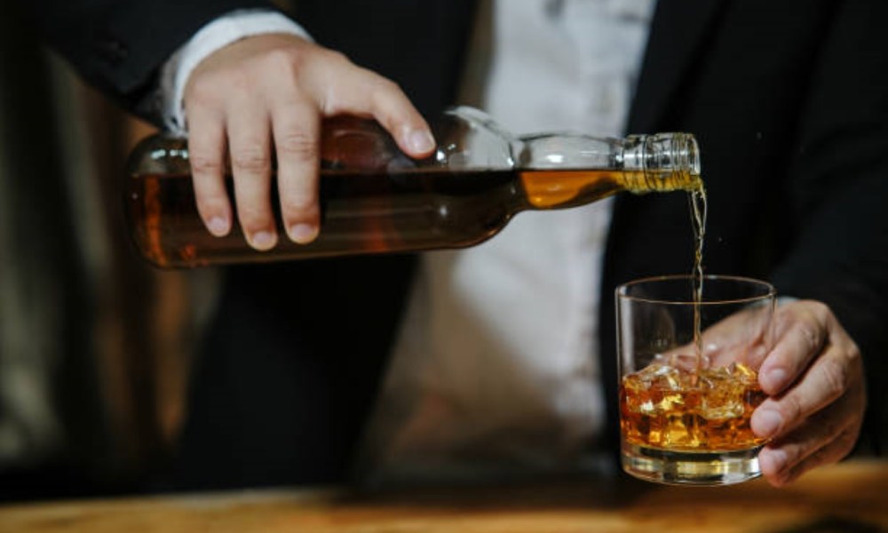 Whiskey pouring into a glass