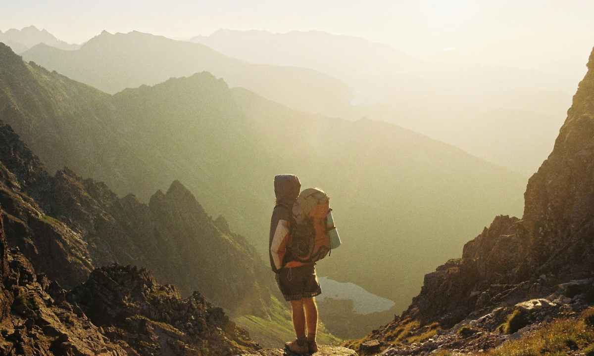 Man standing outside with backpack on