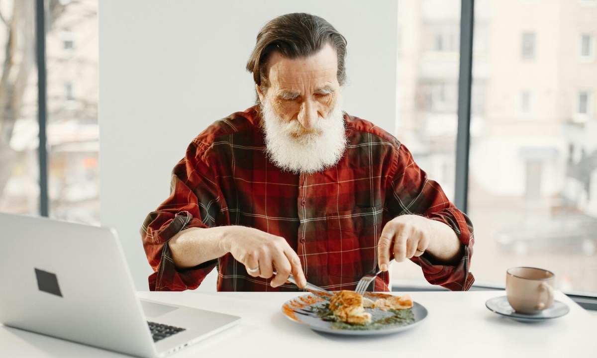 Man eating chicken