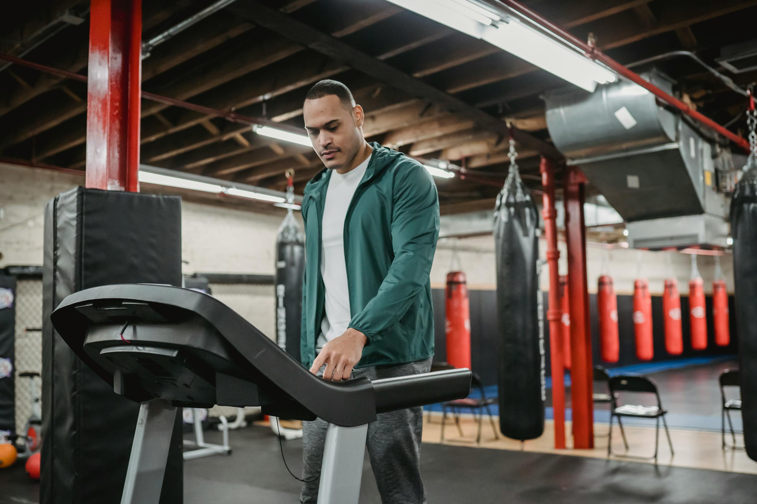 man on treadmill walking using machine in gym