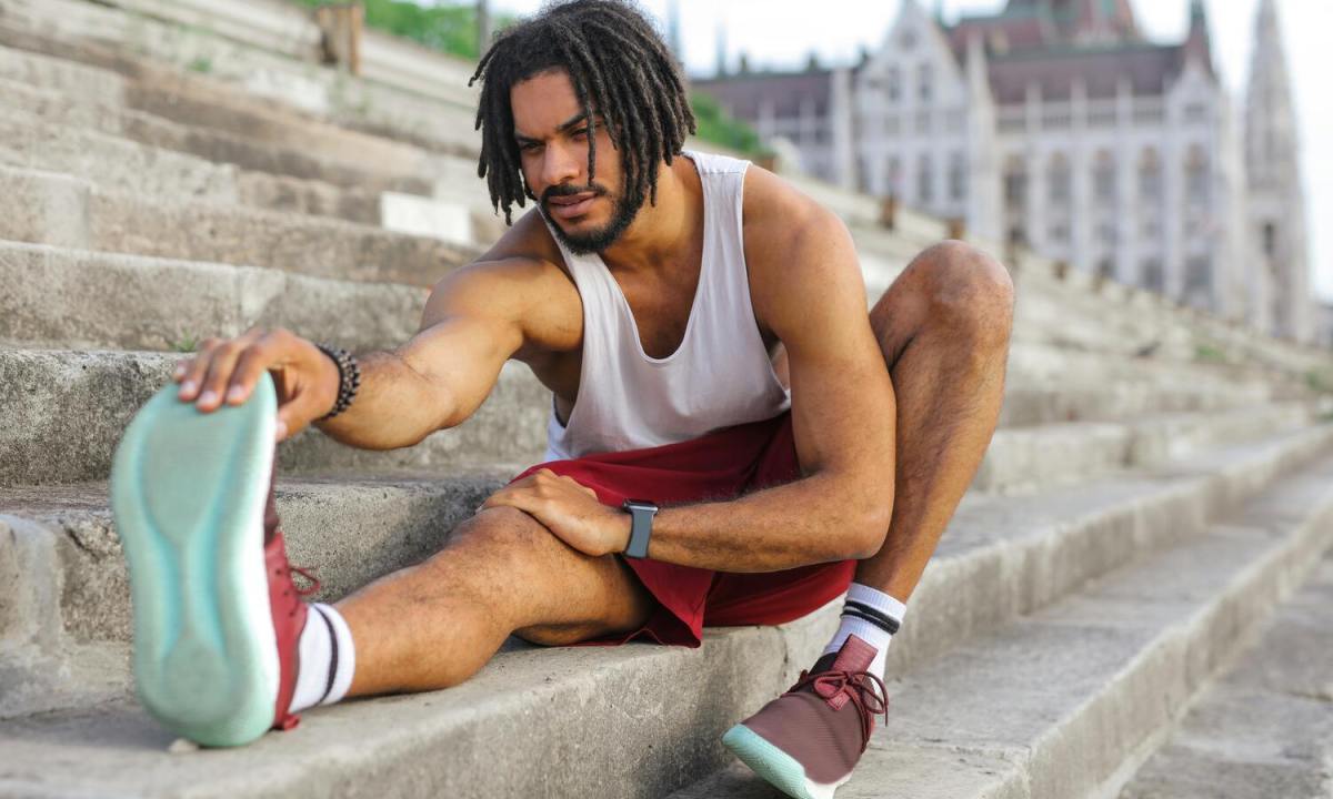 Man stretching in workout clothes