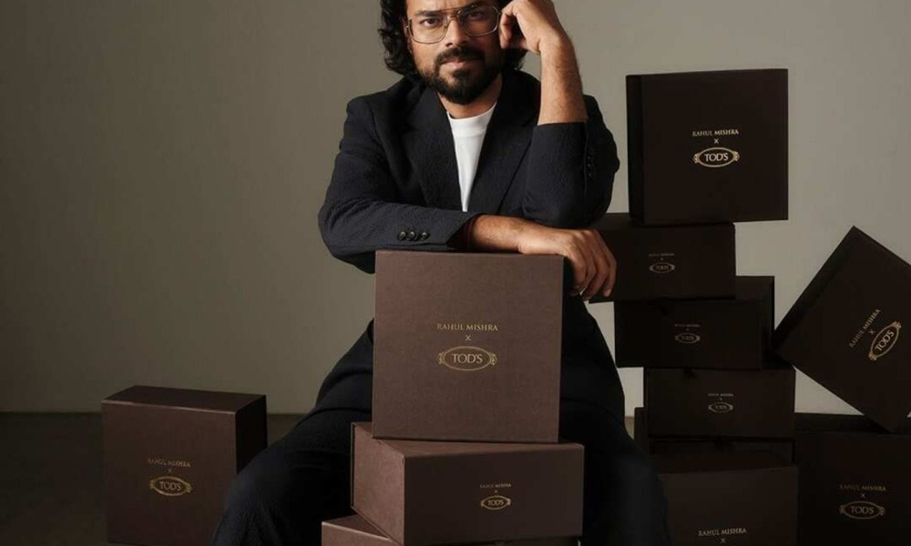 Rahul Mishra sitting against boxes