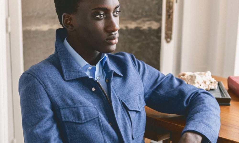 Hockerty bright blue overshirt at a desk