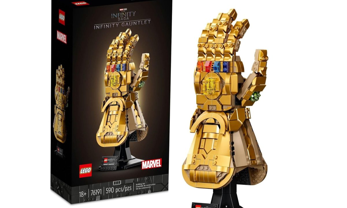 An assembled Lego Marvel Thanos Glove next to its box.