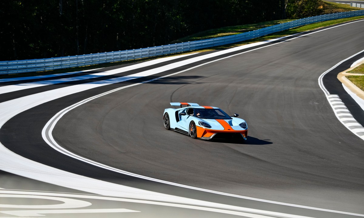 A Ford GT in Gulf racing colors going round the track at ten tenths