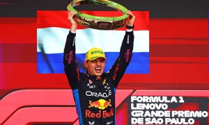 Red Bull F1 driver holds up the winner's trophy after the Sao Paulo Grand Prix.