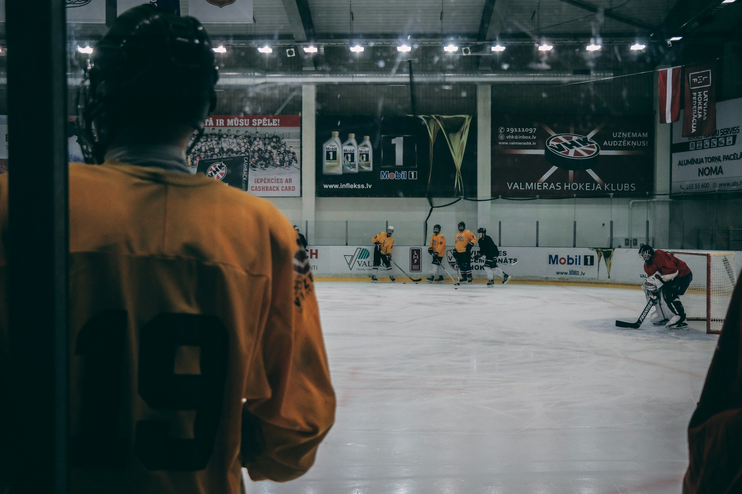 men playing ice hockey