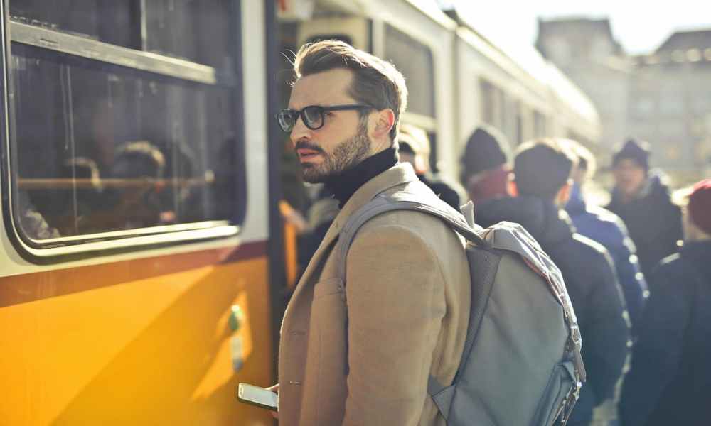 Getting on the train wearing a backpack